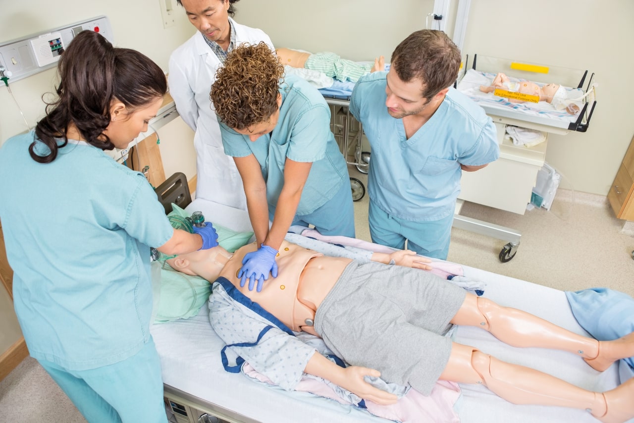 Nurse teaching CPR to other nurses.
