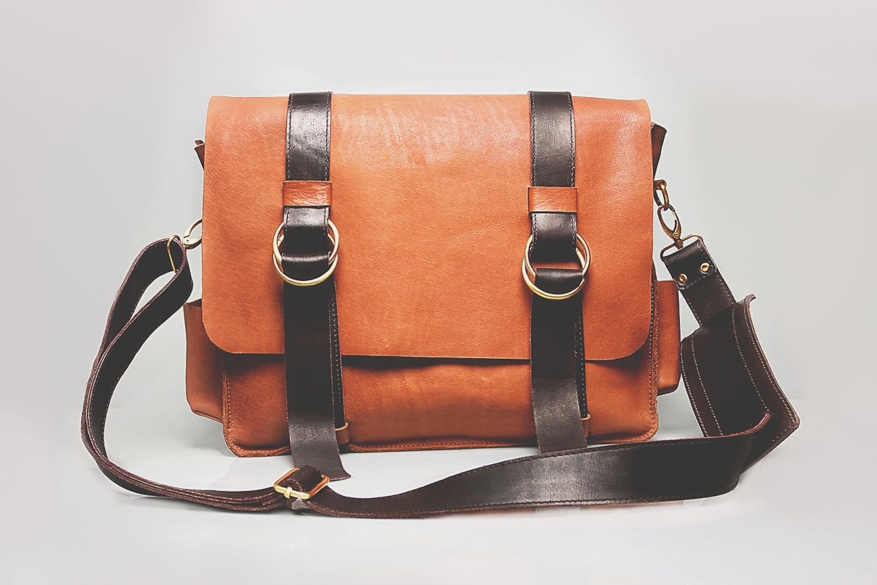 Orange and brown leather satchel bag