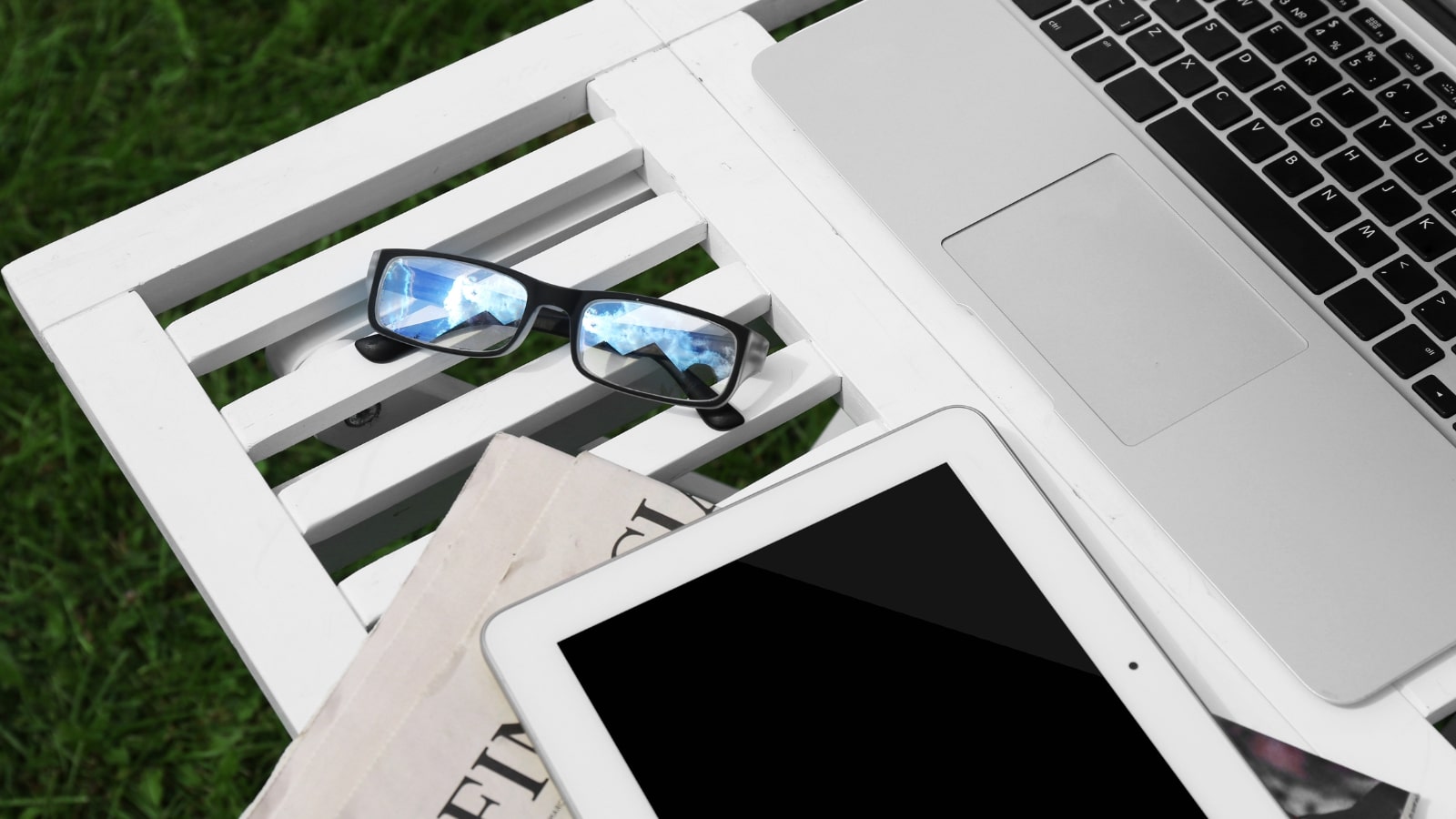 Pair of glasses used for reading marketing content on different gadgets.
