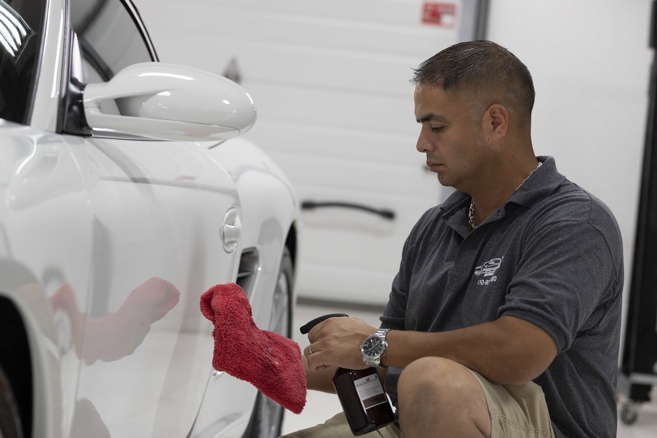 Person doing auto detailing