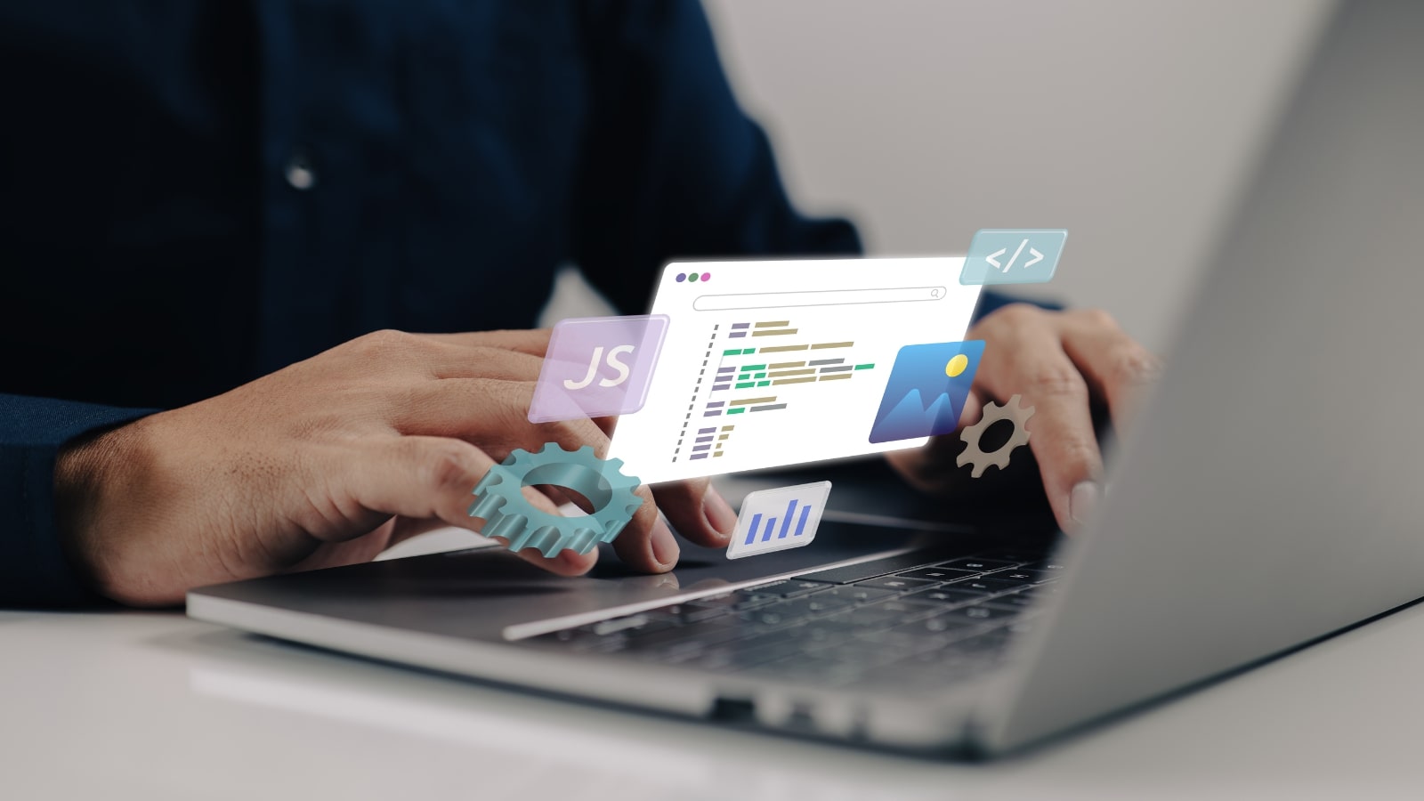 Programmer's hands working on laptop to build website.