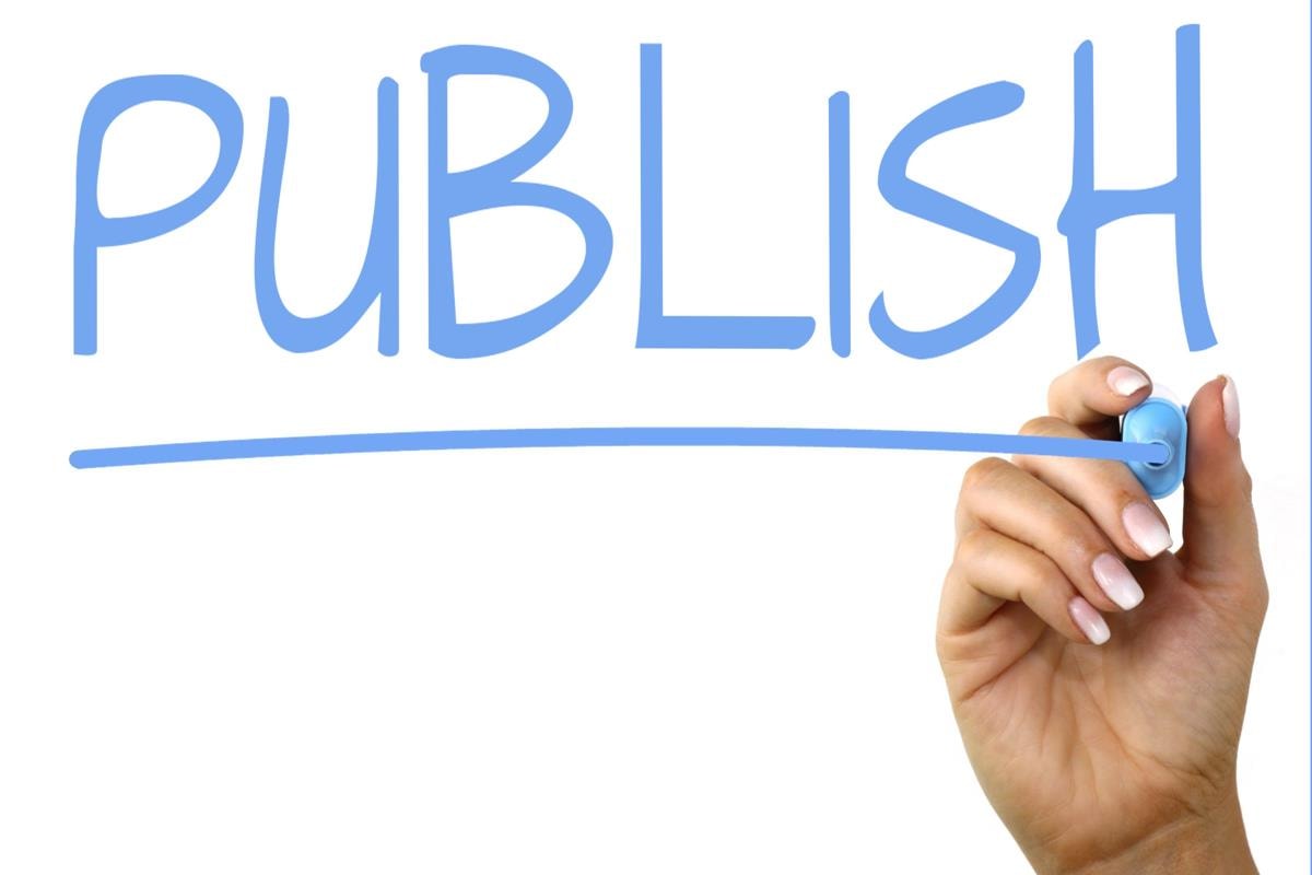 Publish word written on white background.