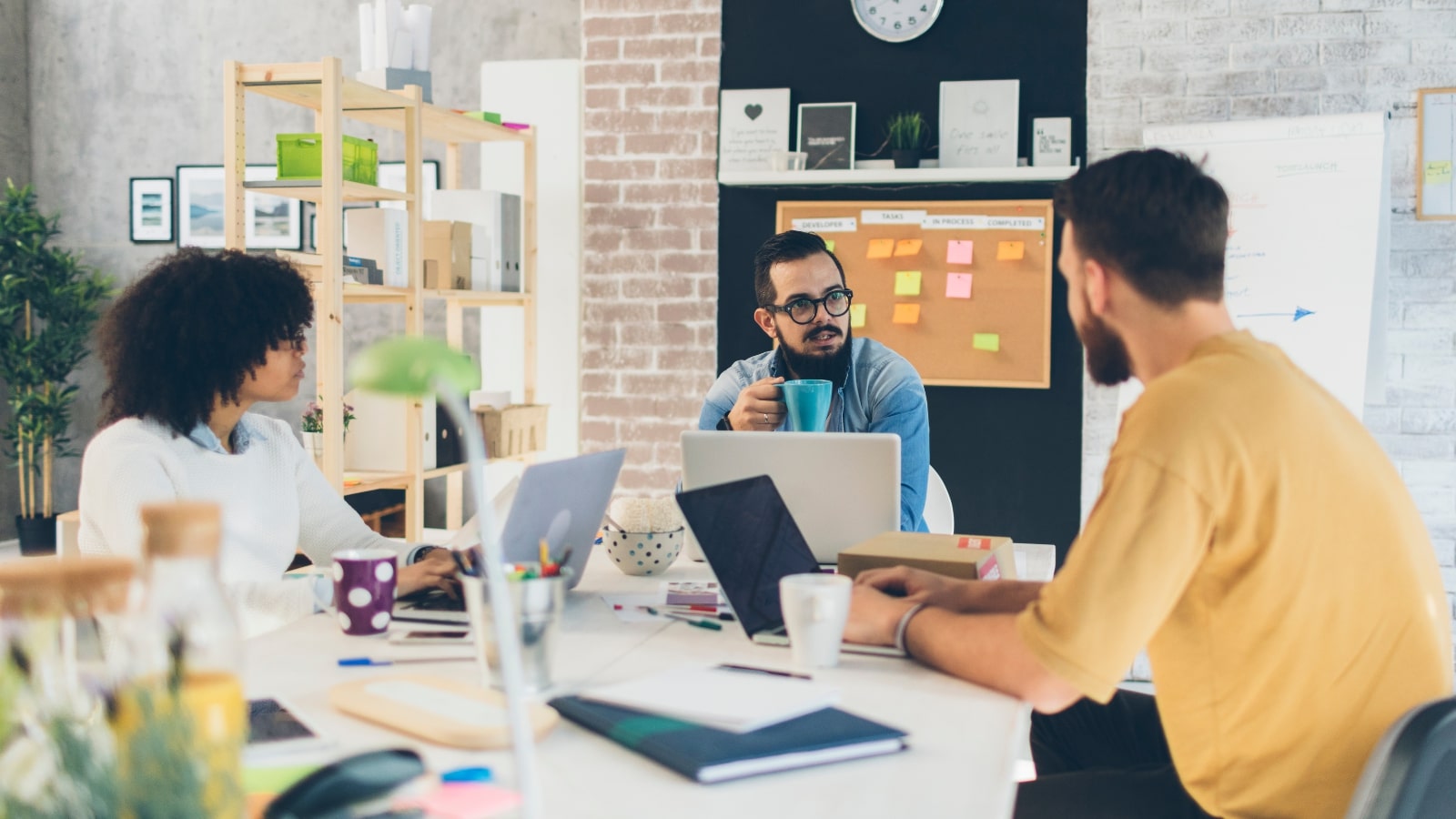 Three people working for a tech startup company.