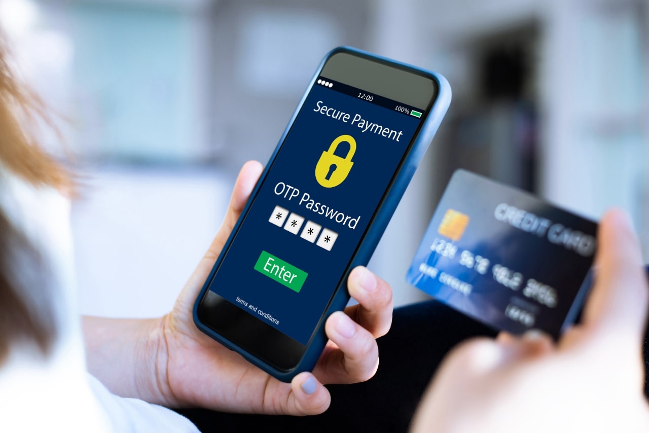 Woman entering passcode to pay online.