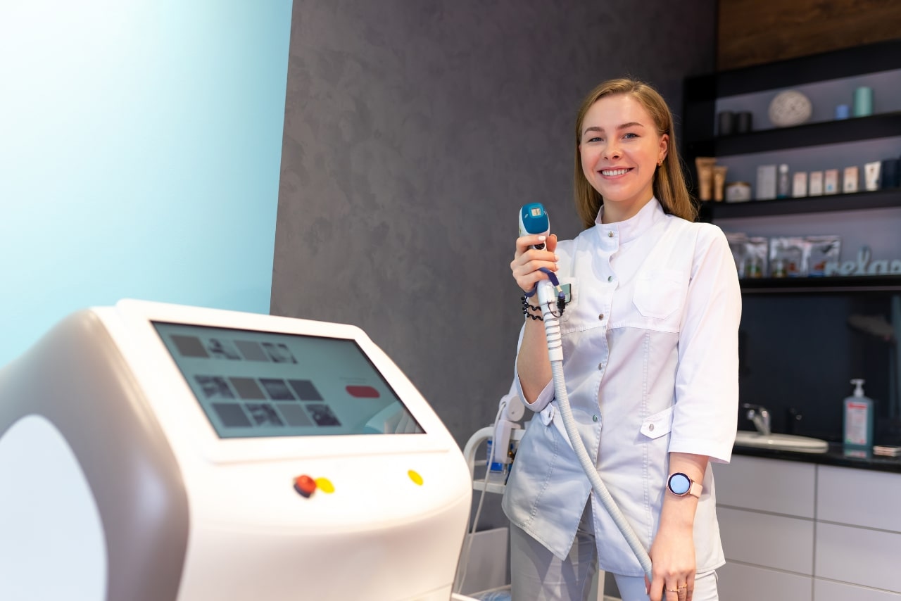 Woman healthcare professional holding a derma wand device.