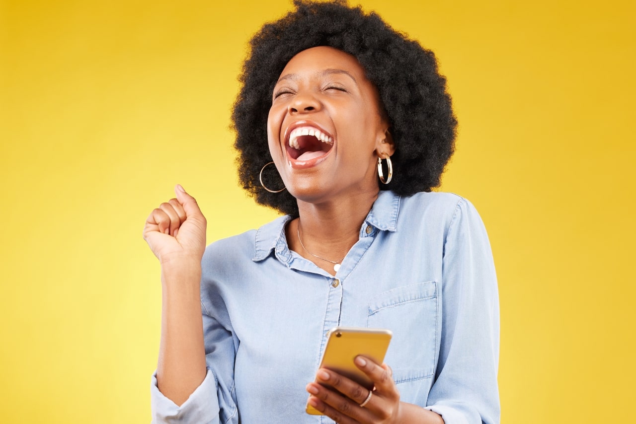 Woman overjoyed with winnings she received over her phone.