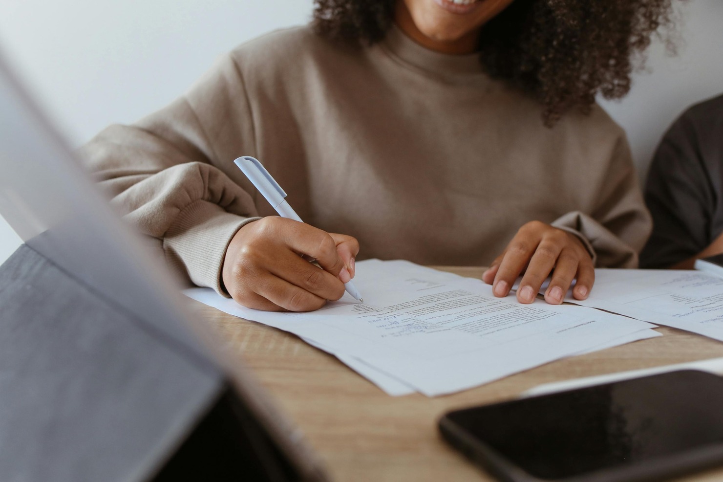 Woman proofreading a document.
