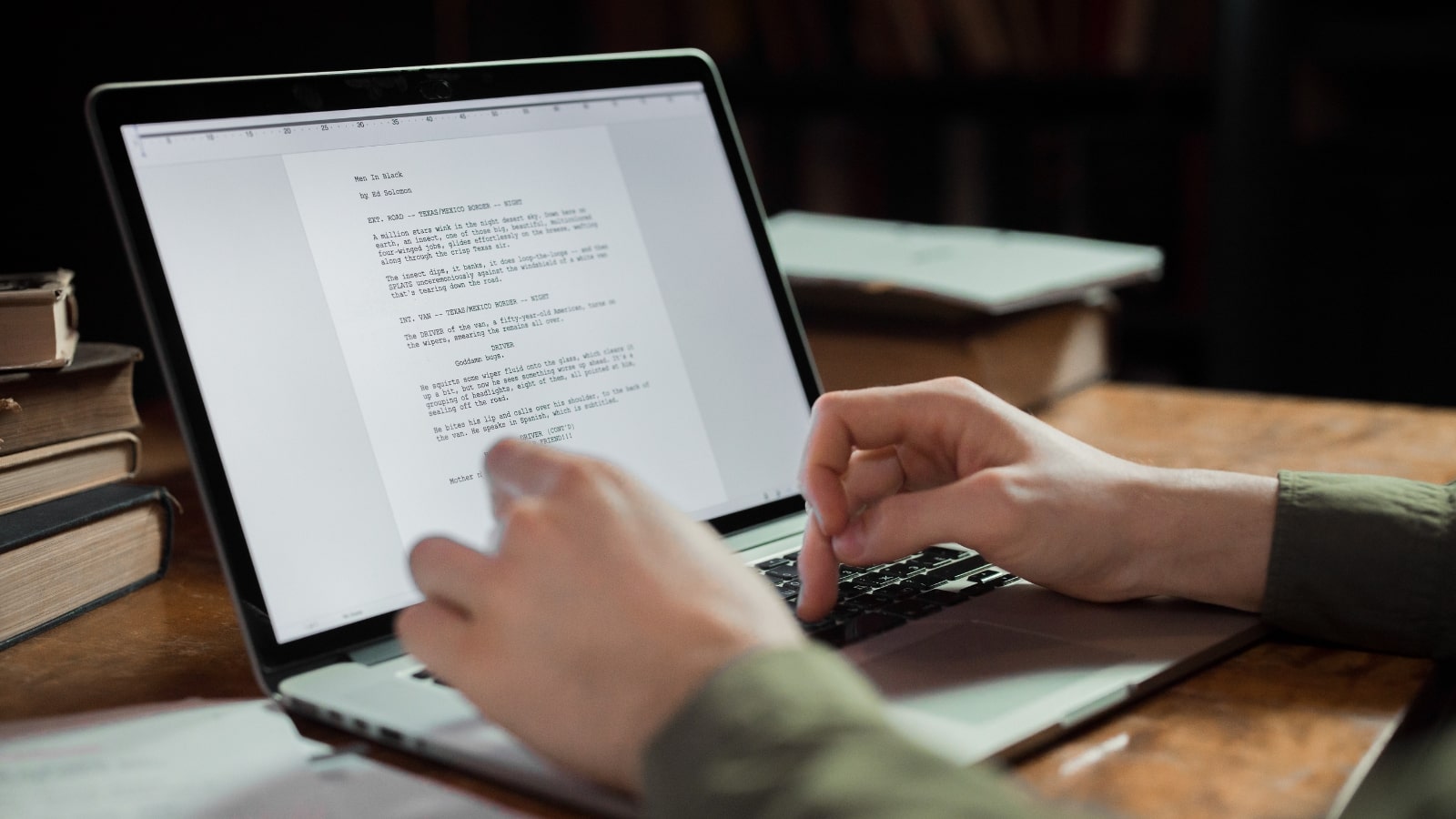 Writer typing on a laptop.