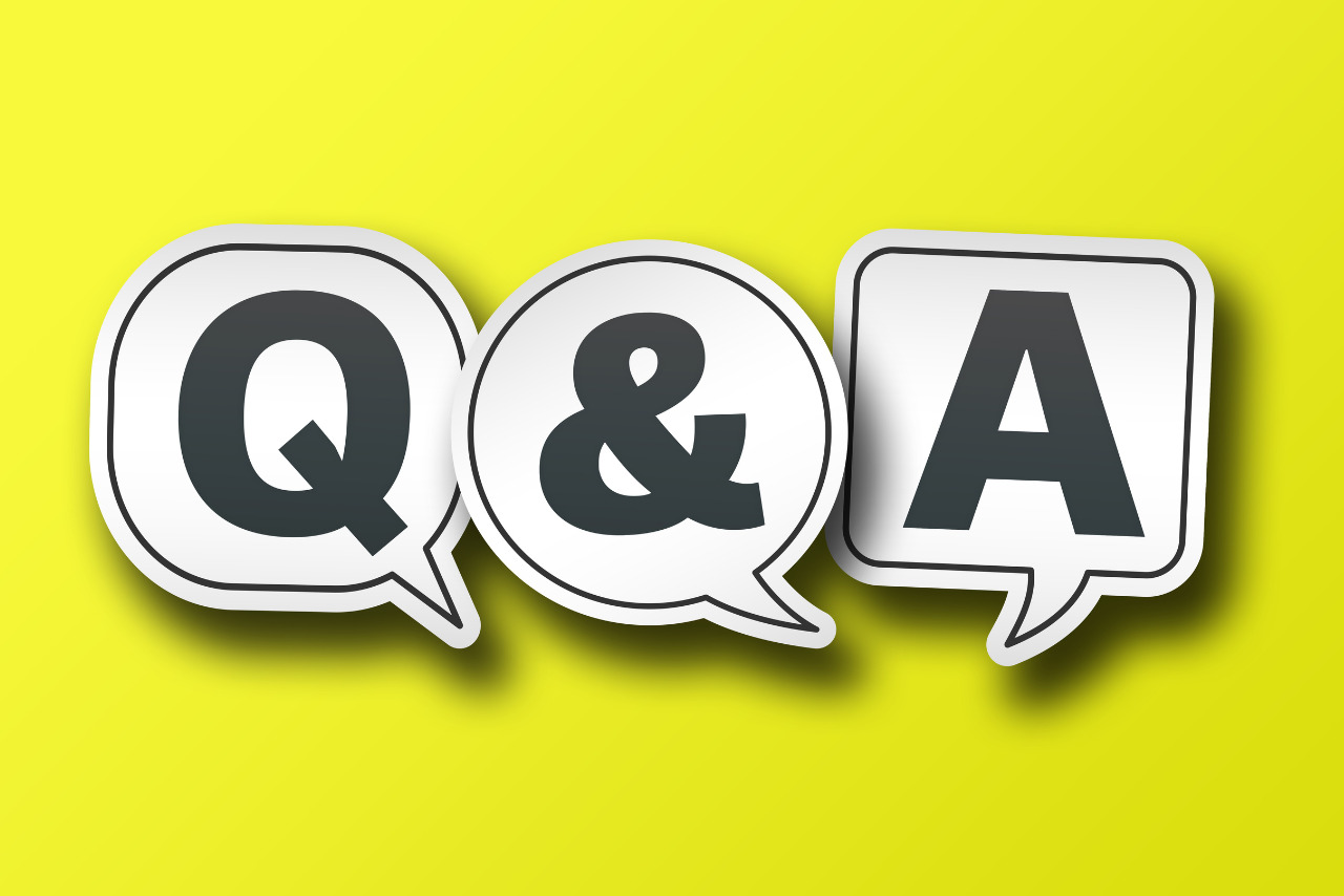 Speech Bubbles with Q and a on Solid Yellow Background.