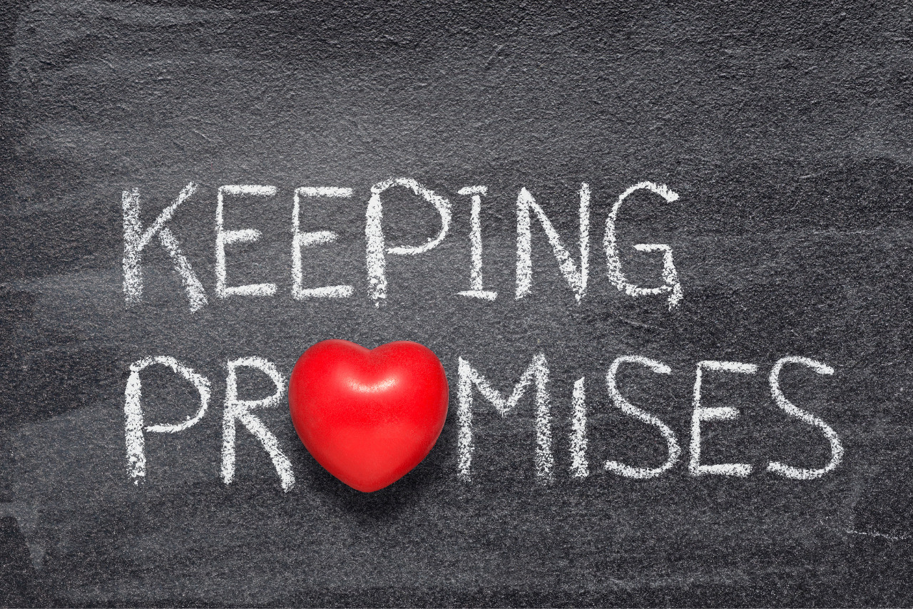 Keeping promises phrase written on chalboard with heart.