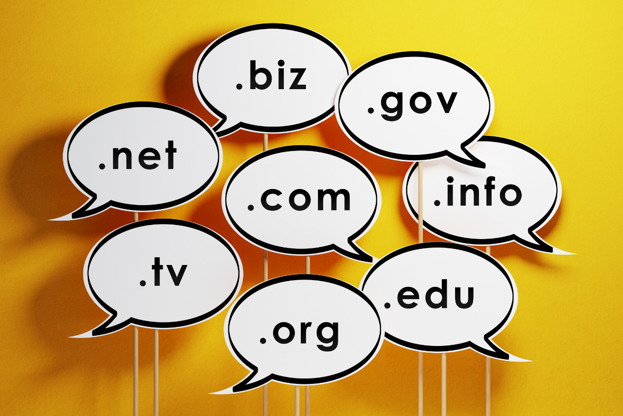 Speech Bubbles With Domain Extensions On Yellow Background.