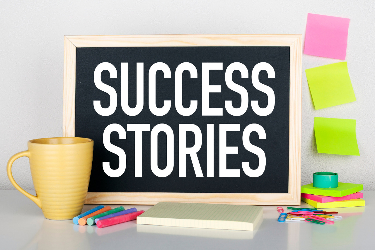 Success stories note on chalkboard.