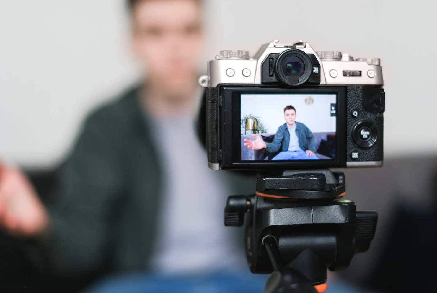 A man filming vlog on camera