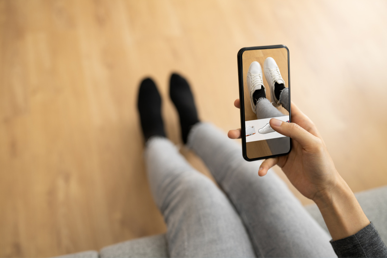 Woman Trying Virtual Sneakers In Online Shop.