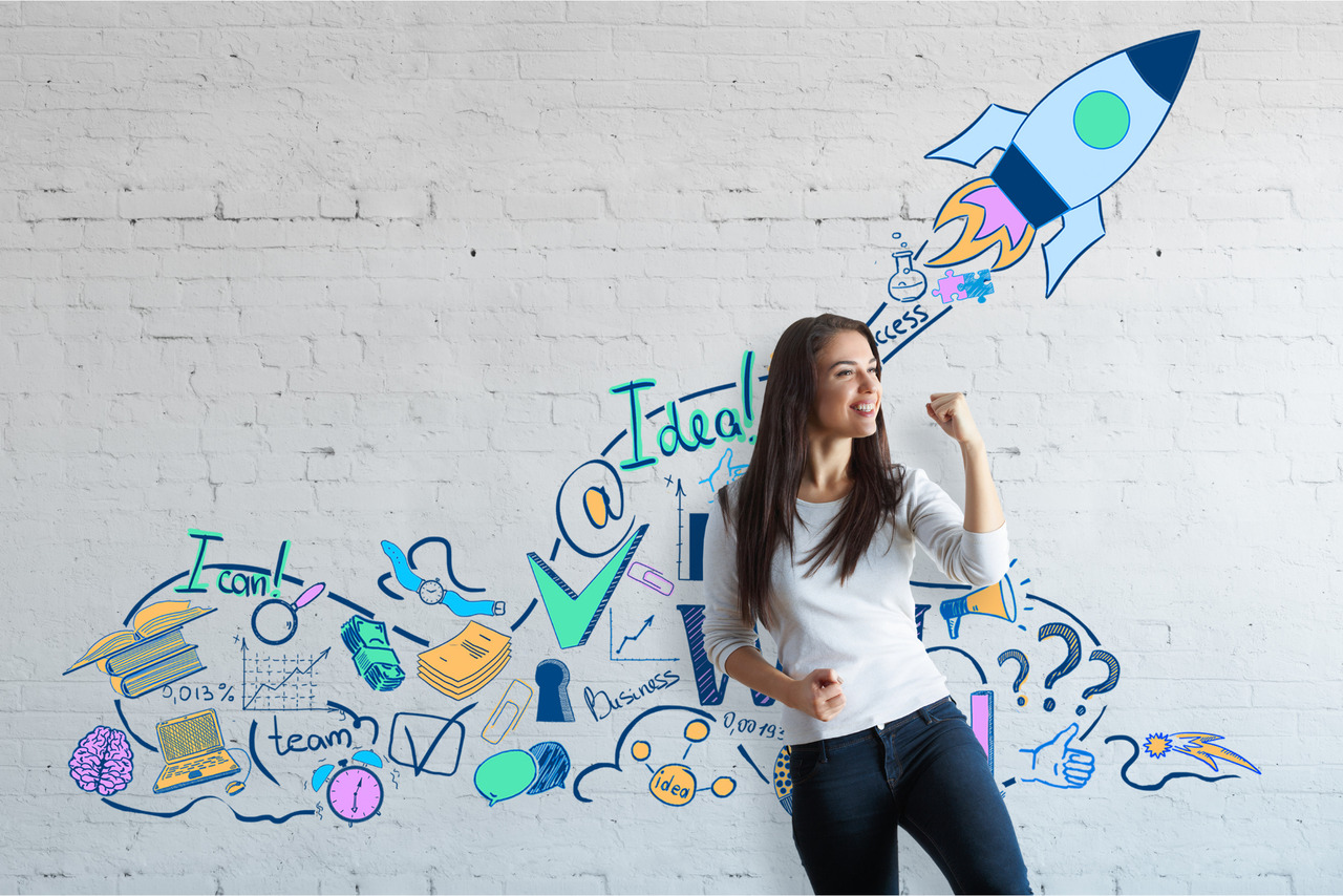 Young woman celebrating success with creative drawn space.