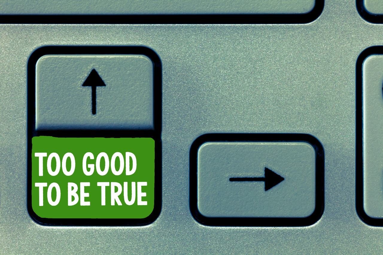 Keyboard text sign showing Too Good To Be True.