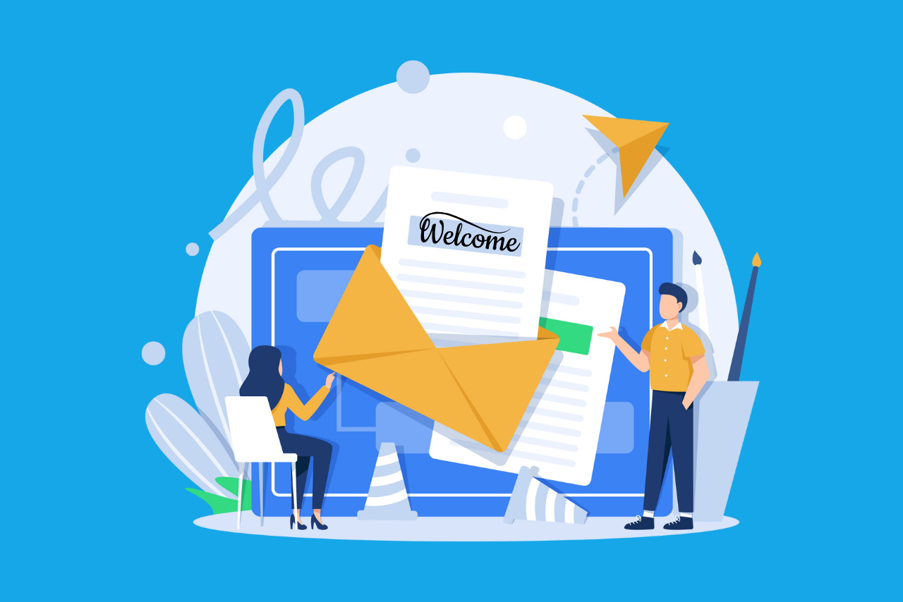 Two marketers collaborate to draft a welcome email.