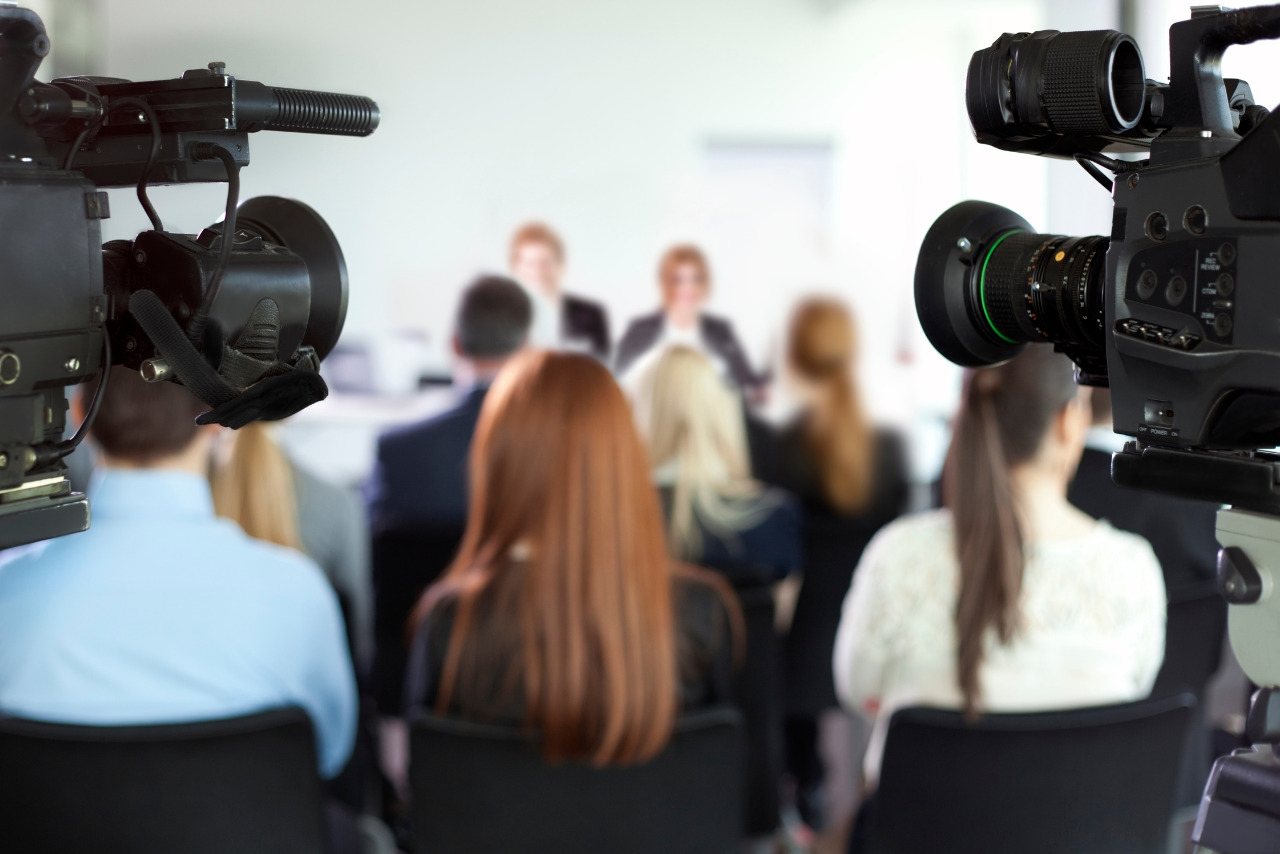 Media capturing a website launch with two cameras.