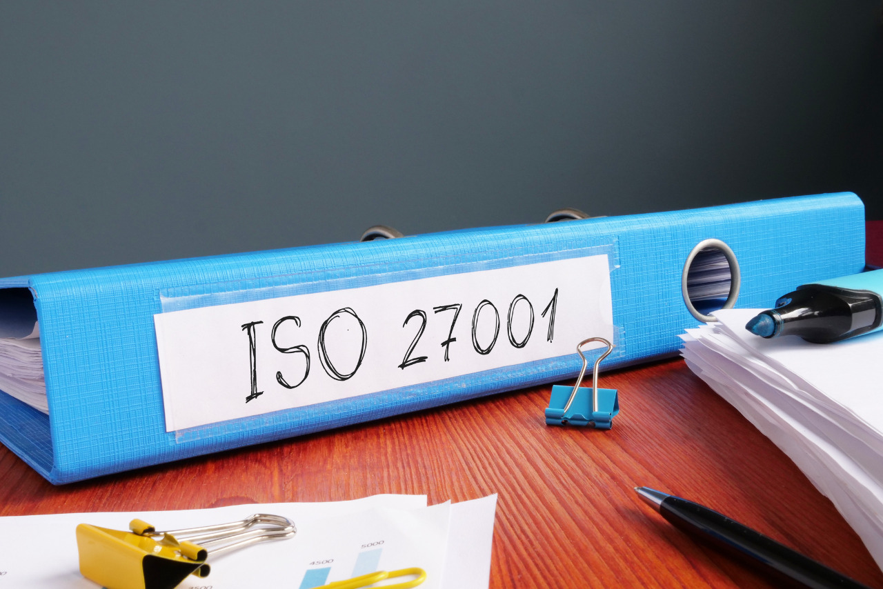 ISO 27001 audit is shown on the business photo using the text.