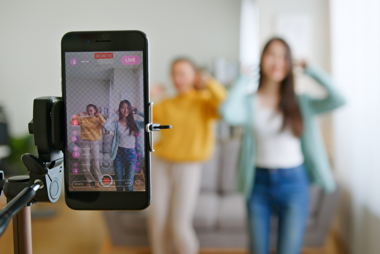 Two women dancing live on TikTok.