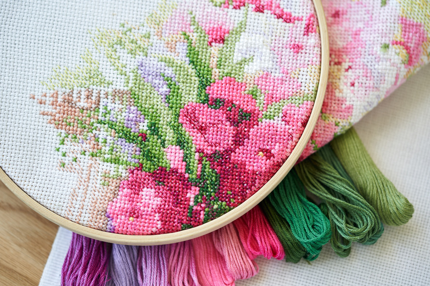 Beautiful floral embroidery on white cloth.