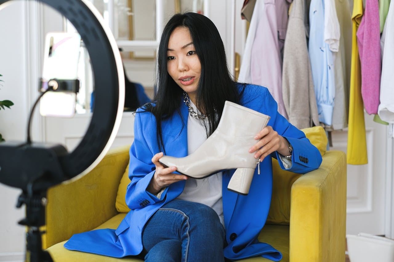 A woman live streaming to sell shoes