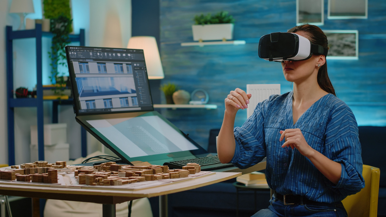 Woman architect using VR glasses for construction development.