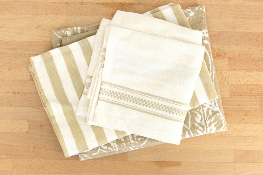 A stack of tea towels sewn from unused fabrics.