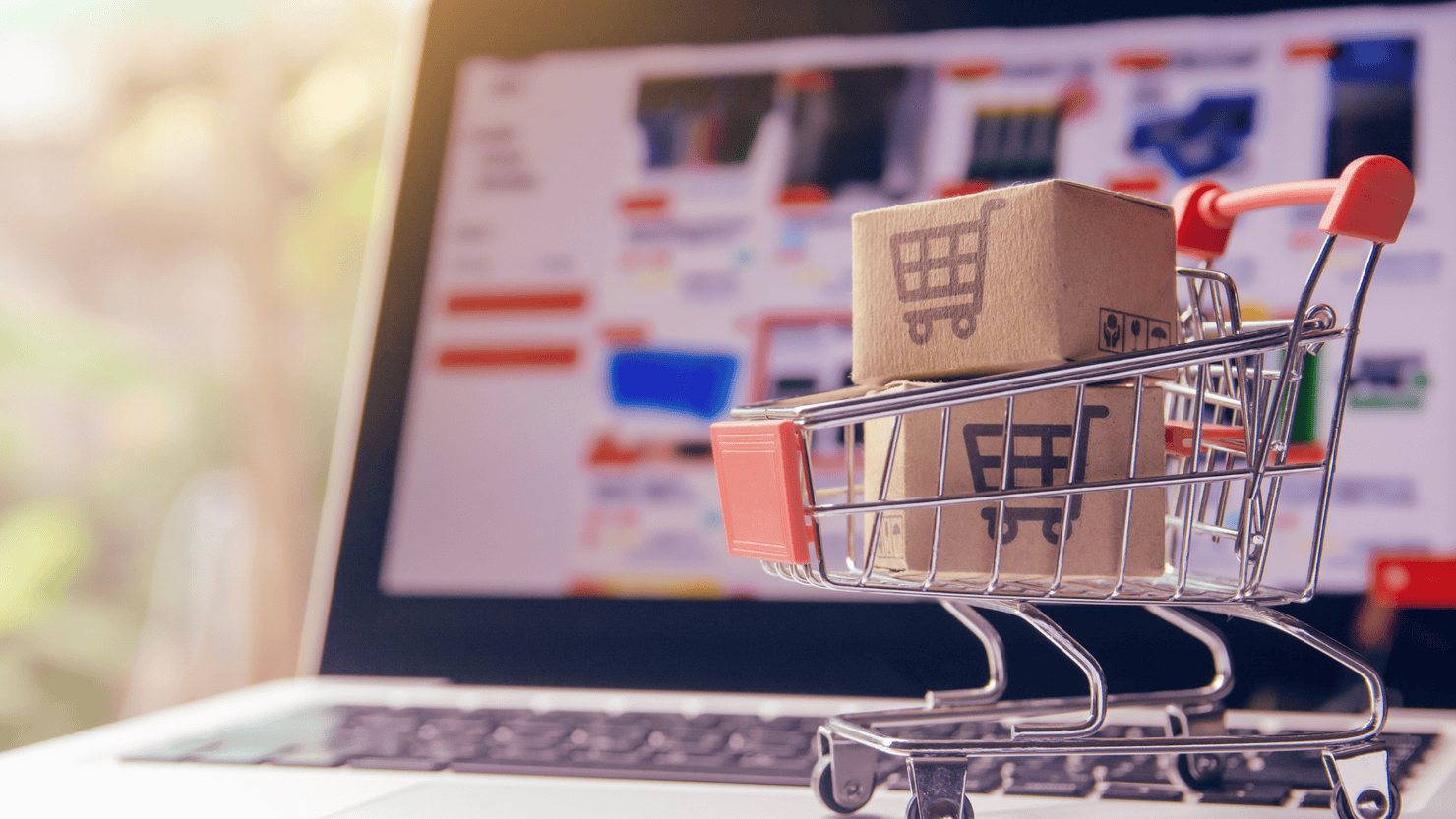 Parcel with a shopping cart logo in a trolley.