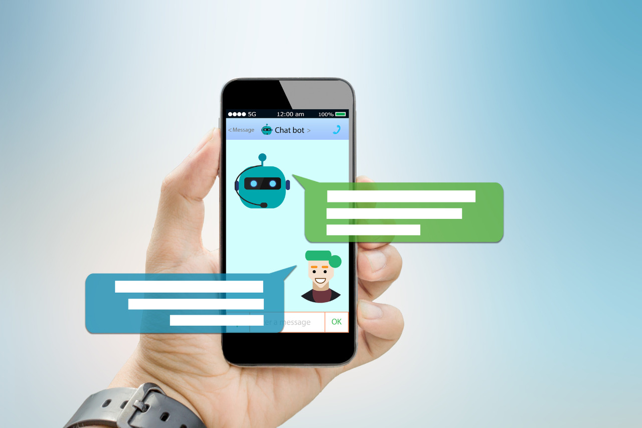 Hand holding phone showing chat convo with bot.