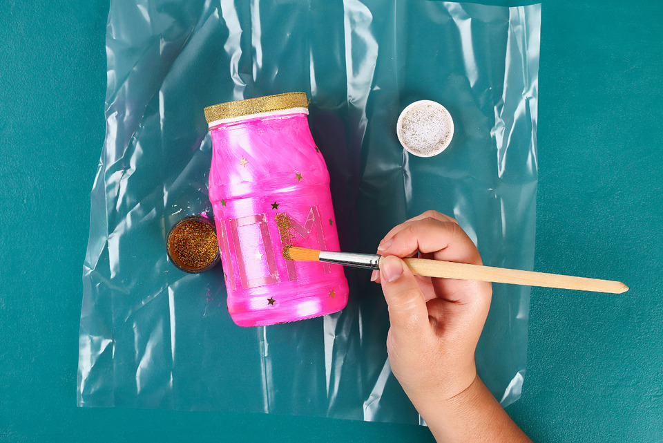 Hand painting on mason jar.