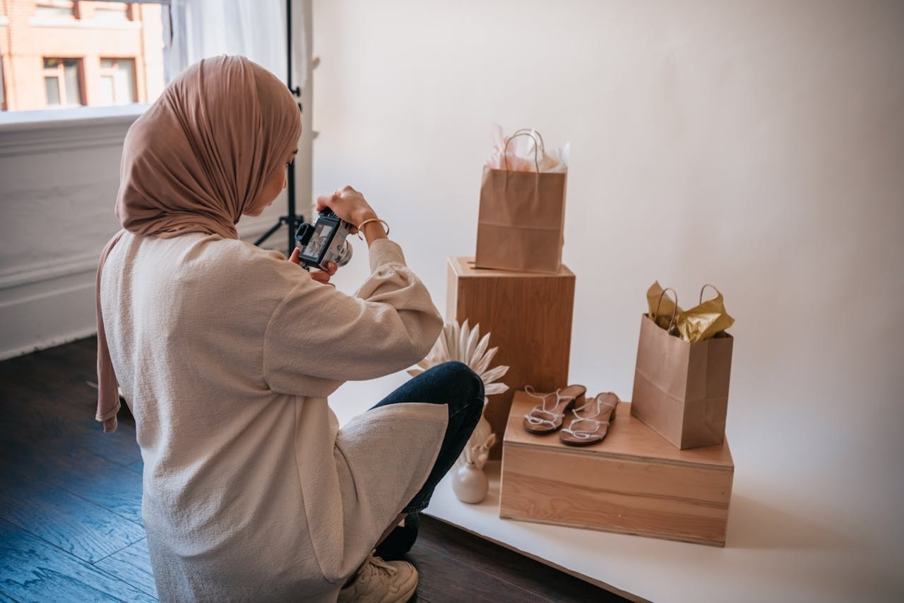 A woman taking photos of a product