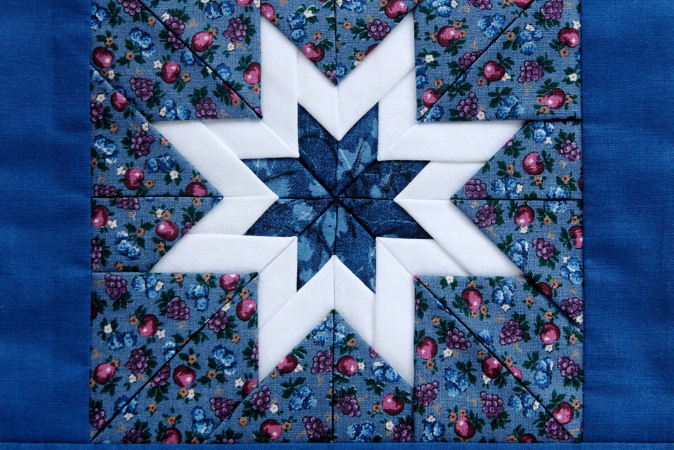 Star quilt made from denim patches.