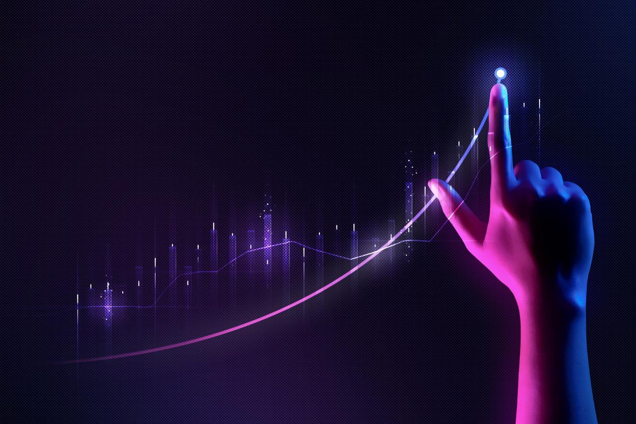 Hand on an increasing line graph showing financial projections.