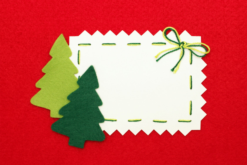 Empty greeting card with christmas tree design made from felt.