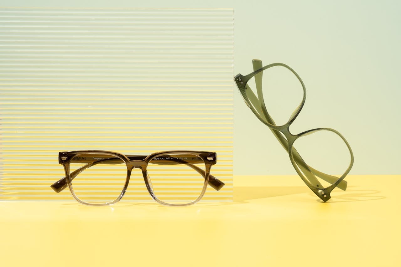 Modern minimalist eyeglasses on a pastel background