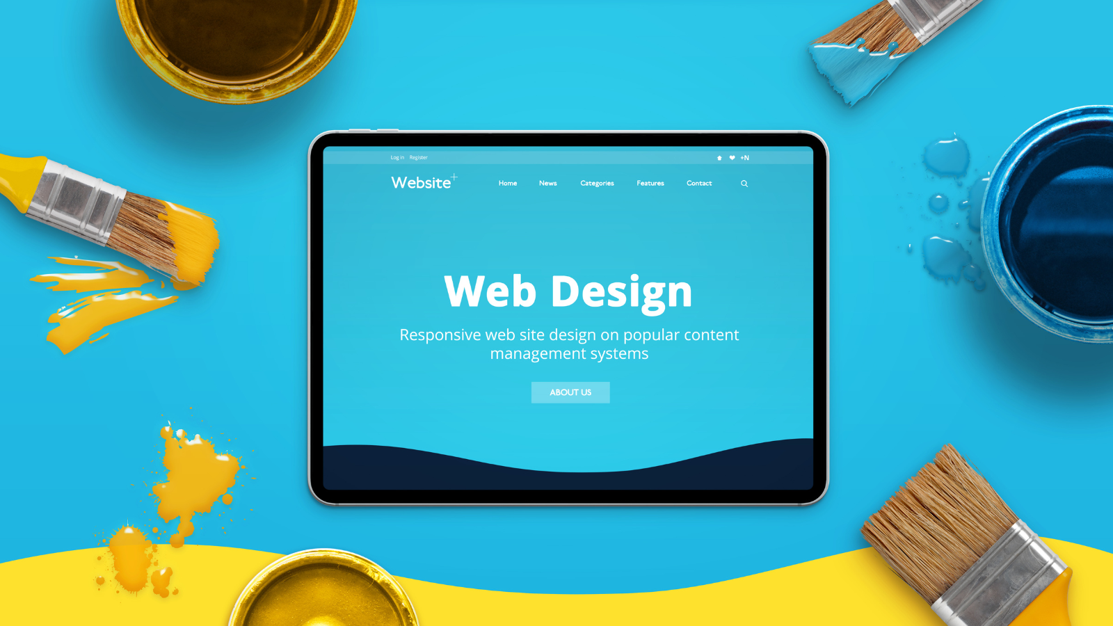 Modern web design concept on a thin tablet, surrounded by color brushes and boxes, top view.