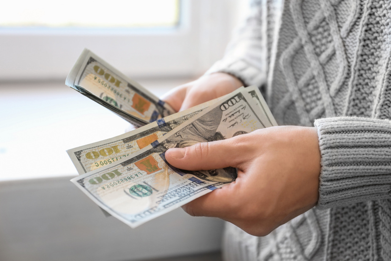 Person counting cash.