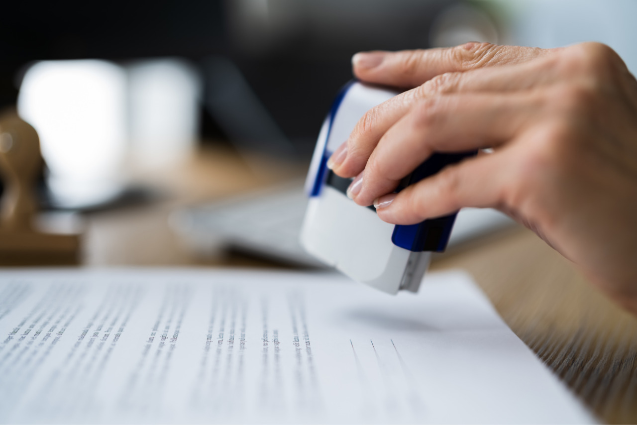 Stamped business permit document for approval.