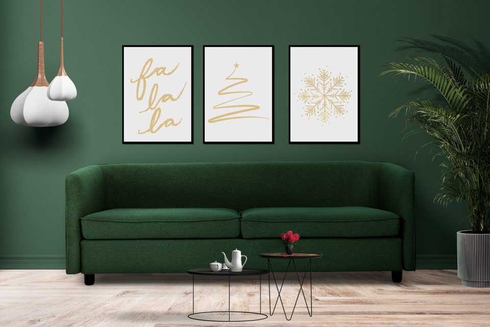 Three cohesive christmas wall art hung on living room wall.