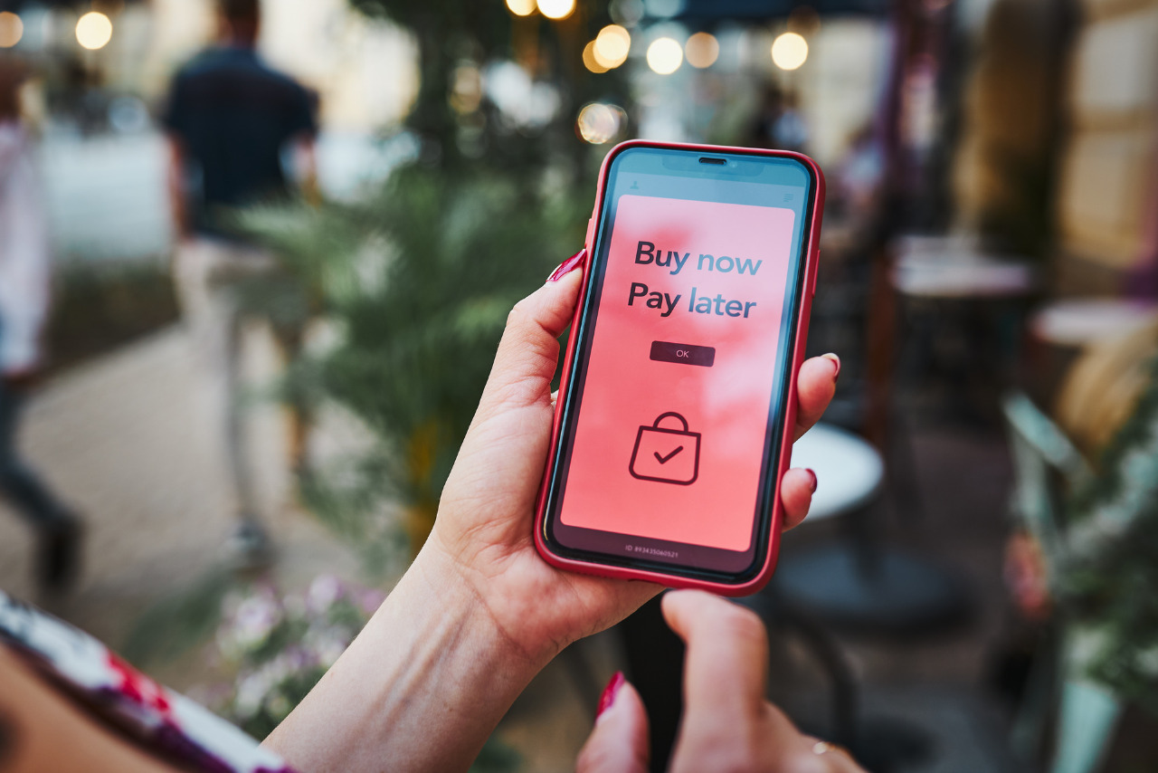 Woman avails the BNPL Buy now pay later service on smartphone.