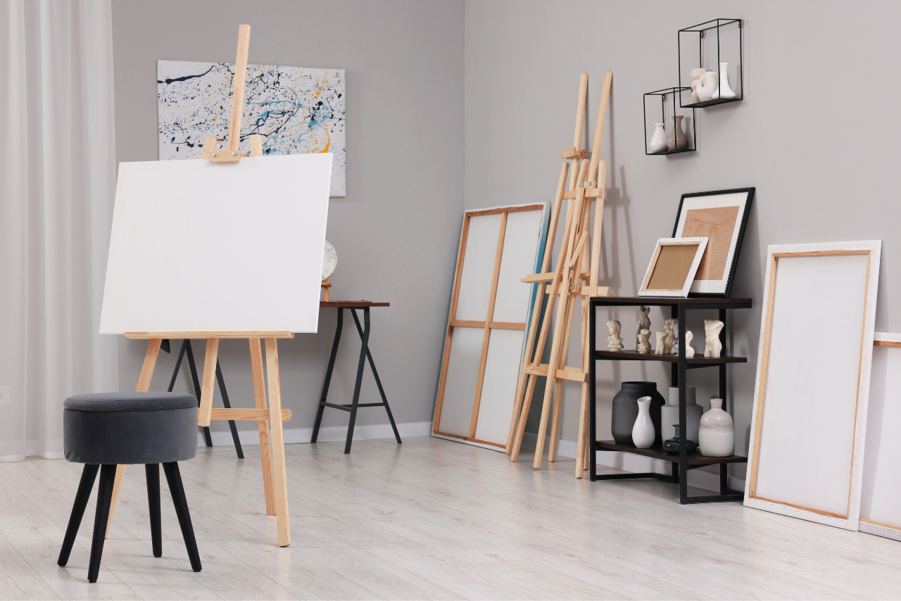 Artist's Studio with Easels, Canvases and Painting Supplies.