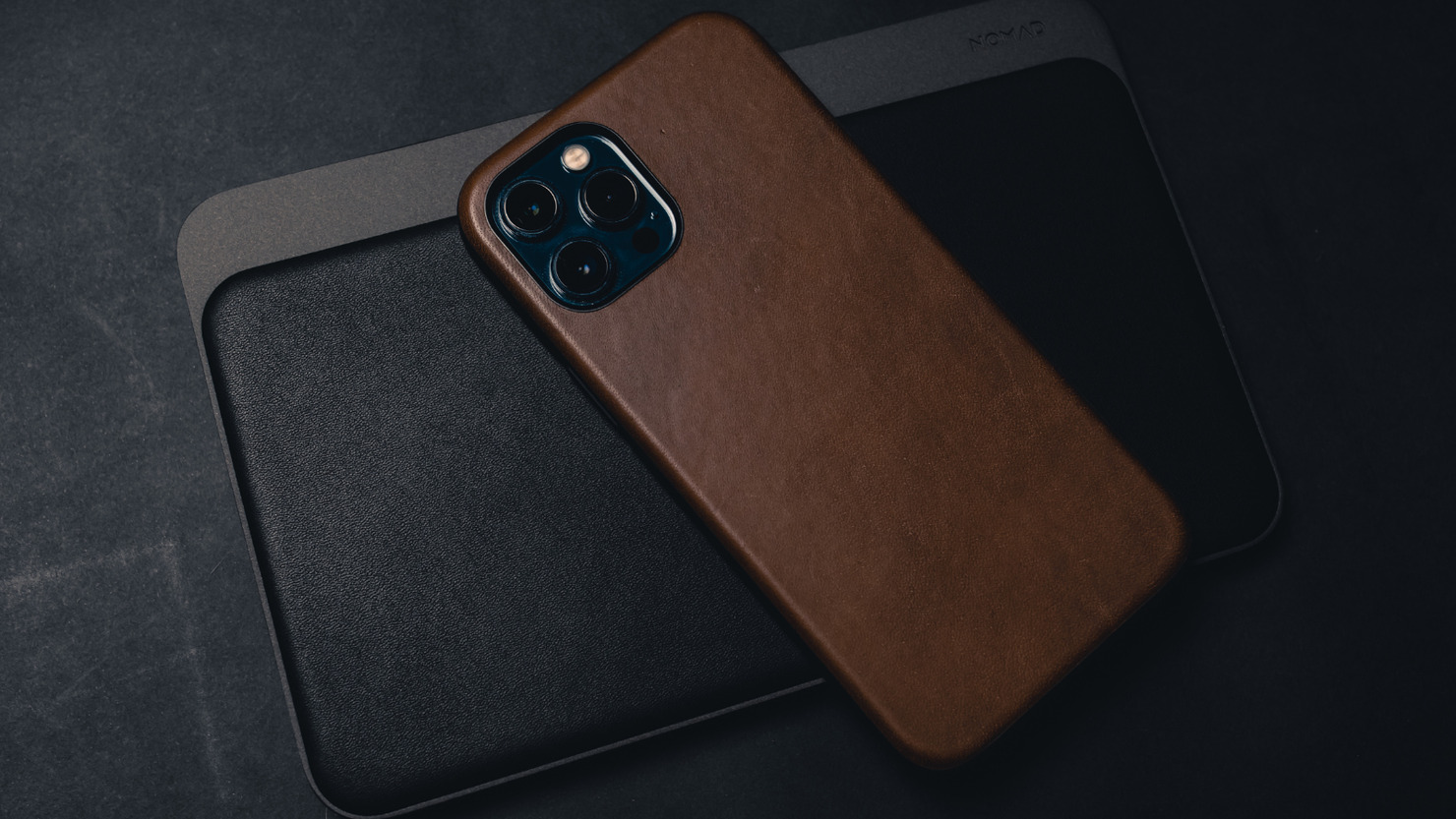 Latest Iphone with brown leather case.
