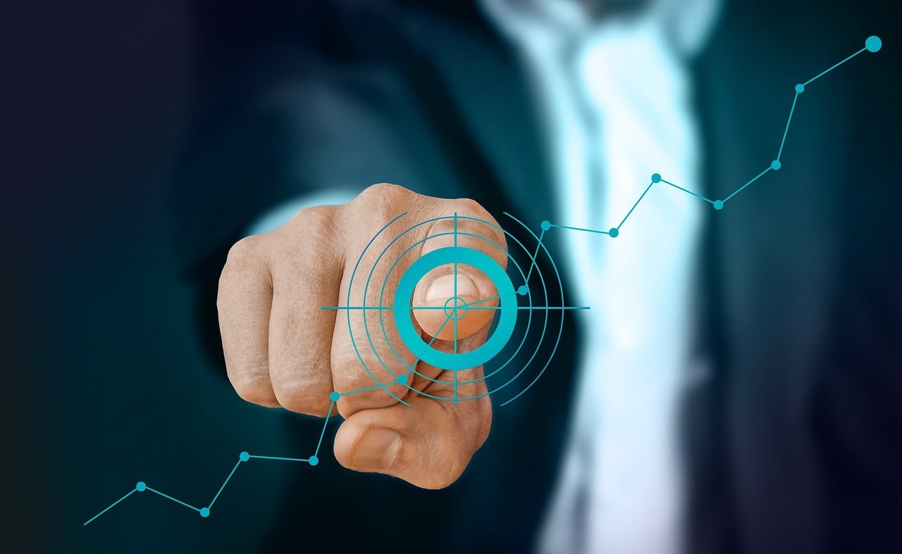 A man pointing at a circle target