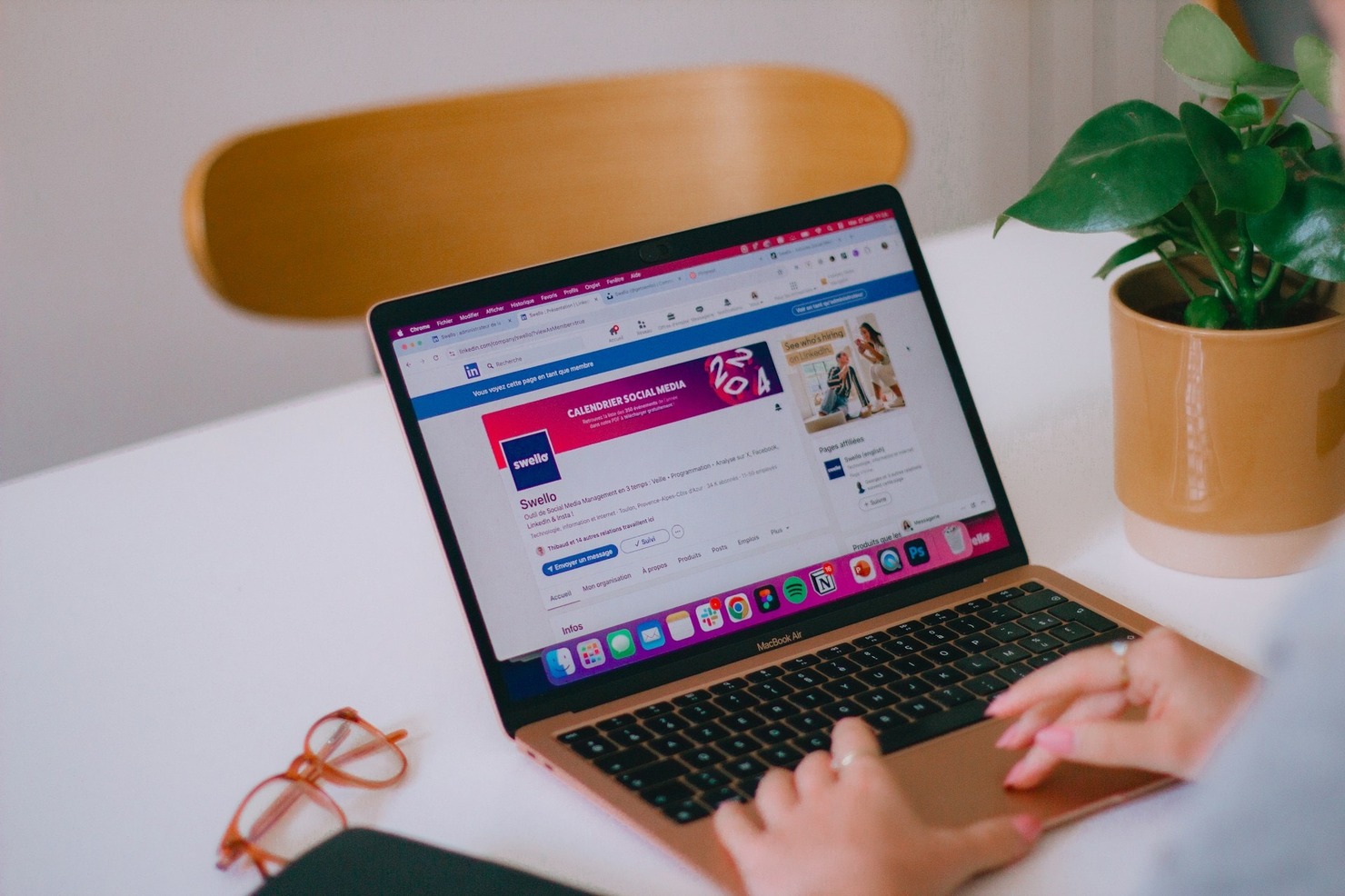 A person browsing LinkedIn on a laptop