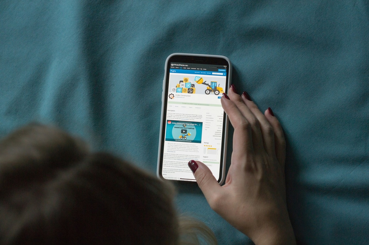 A person browsing WordPress on a mobile phone