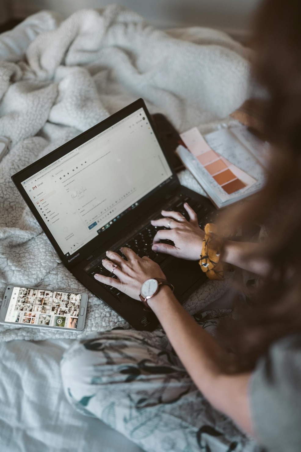 A person writing an email