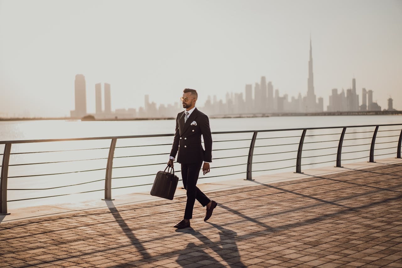 A well-dressed businessman holding a bag while walking