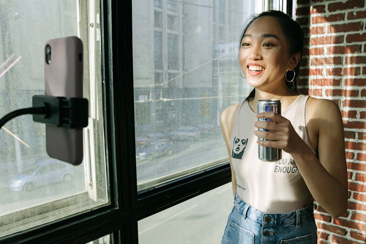 A woman doing live stream endorsing a sports drink