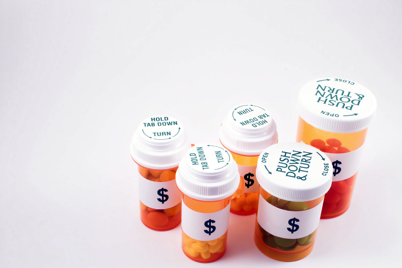 Amber pill bottles with dollar signs on label.